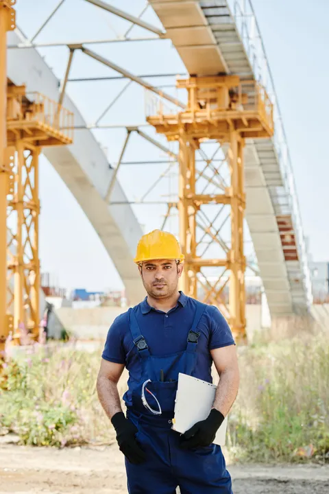 Construction site manager reviewing documents during an inspection