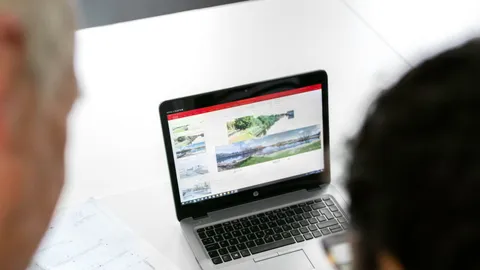 Property professionals studying a site plan and street access