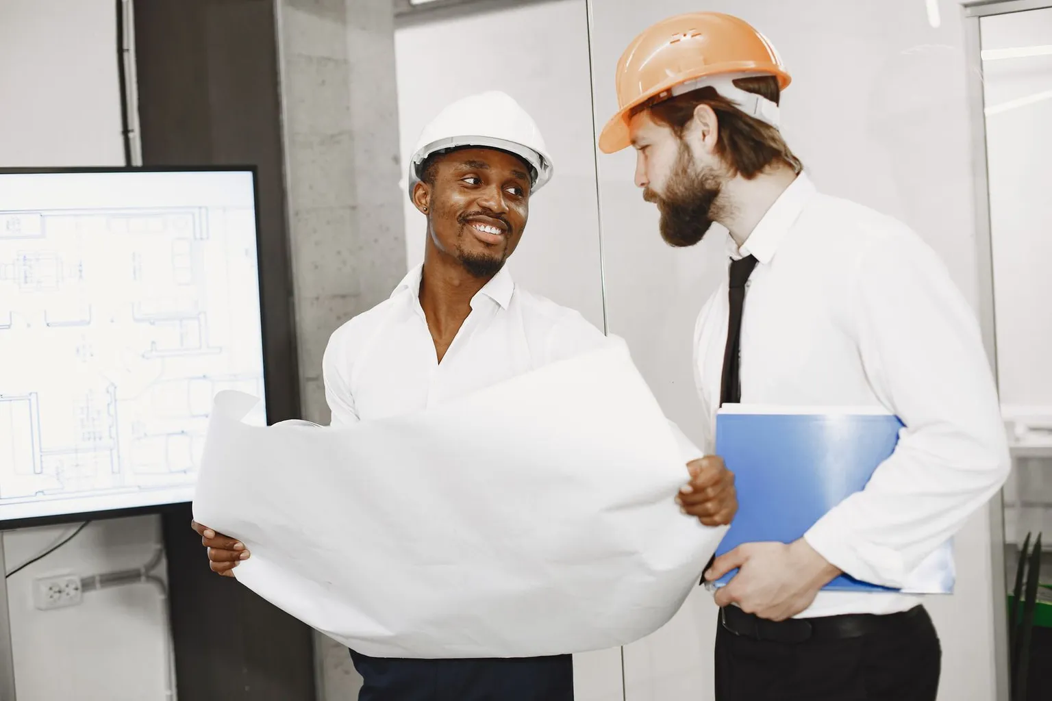 Construction professionals reviewing plans to determine an approval pathway