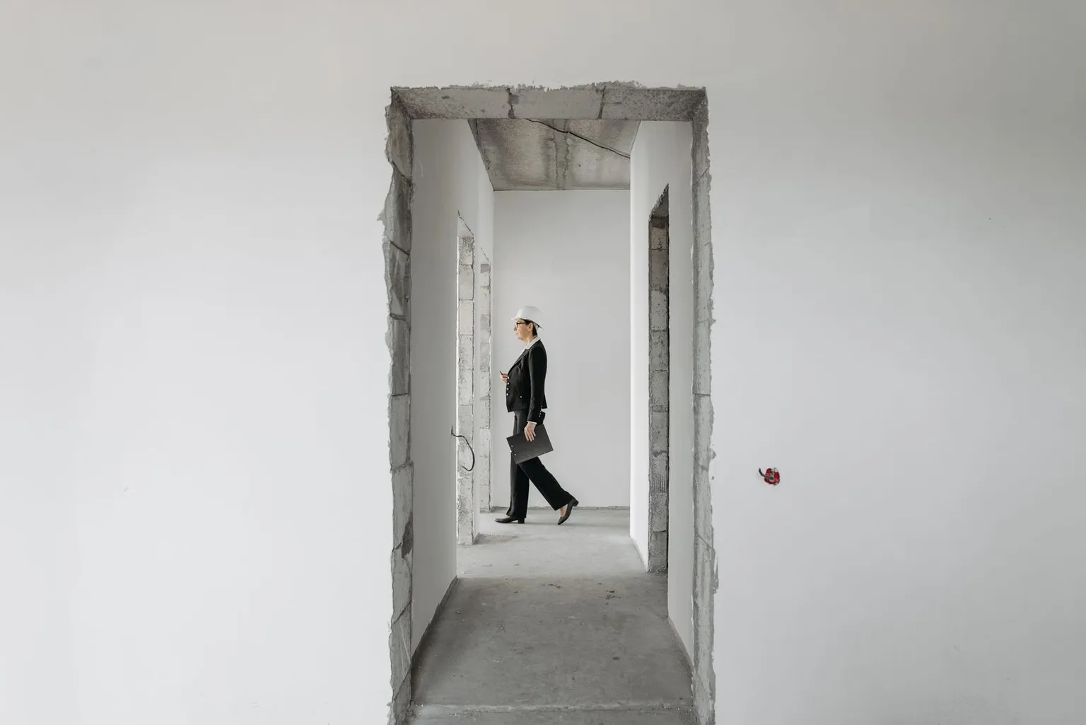 Property professional inspecting an unfinished development site