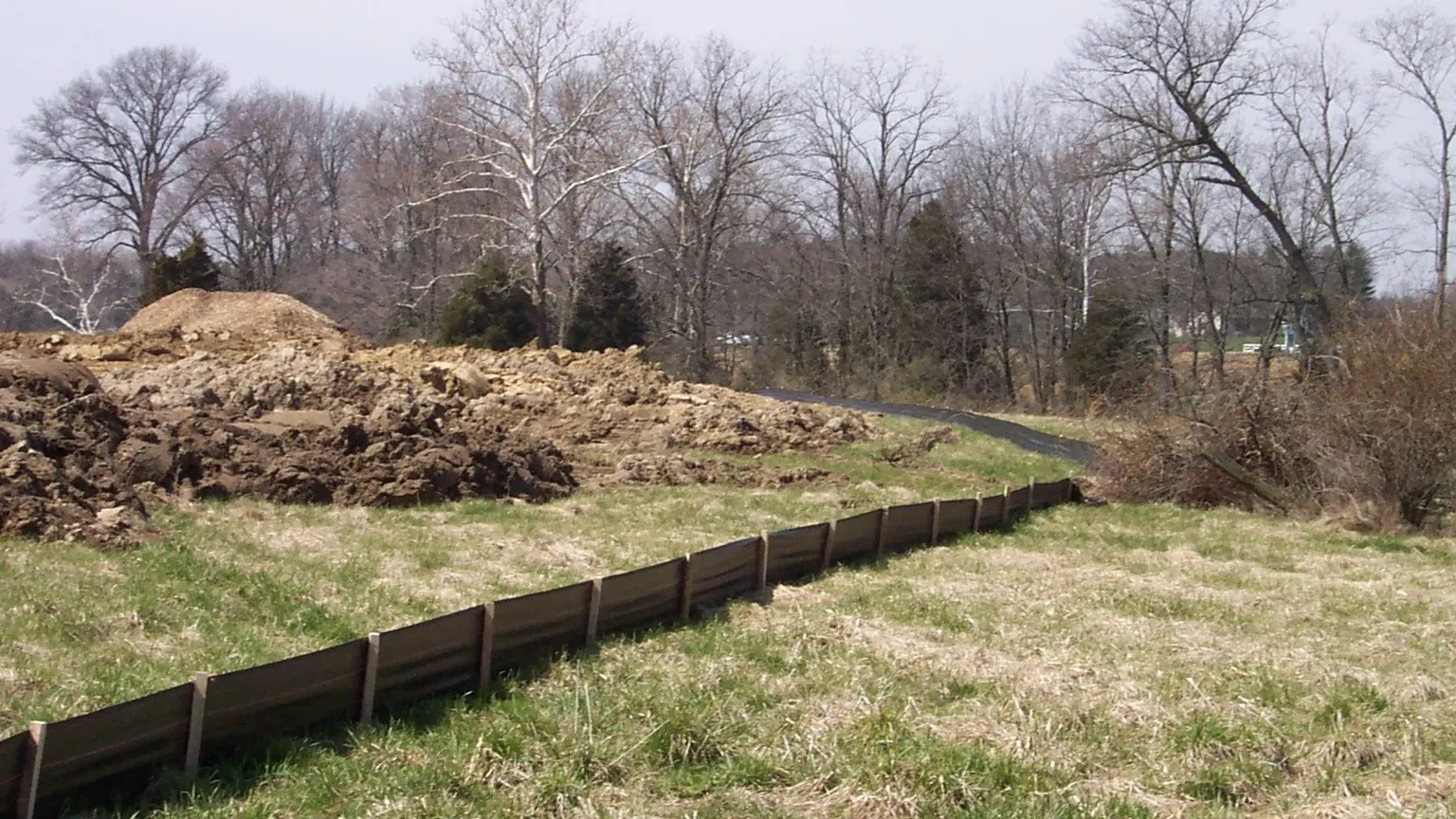 Silt fence installed as a sediment control barrier on a construction site