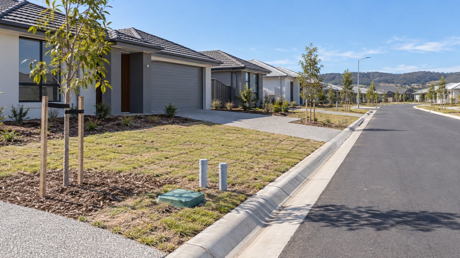 Illustrative new Australian street with an underground utility pit in the verge