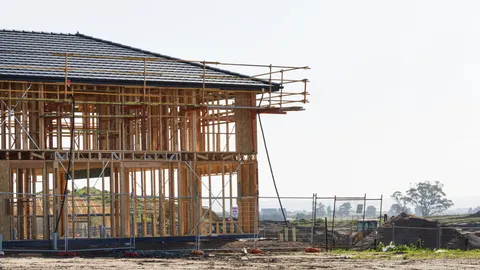 Australian house construction frame and scaffolding used to illustrate NSW design documentation compliance checks.