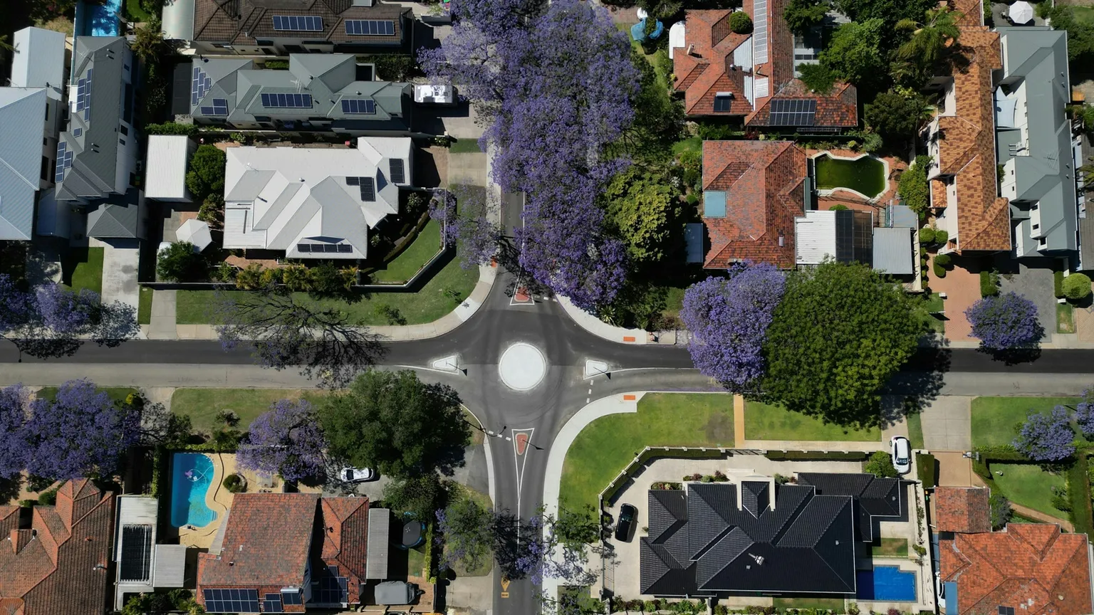 Aerial view of Australian residential streets used to illustrate NSW subdivision certificate and registration checks.