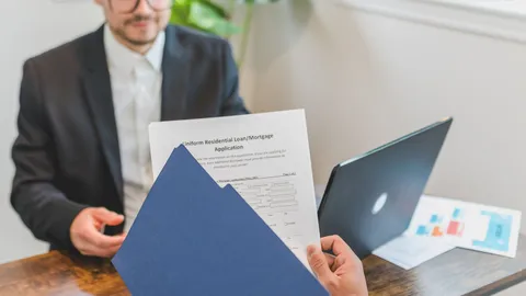 Joint venture partners reviewing finance obligations with an adviser