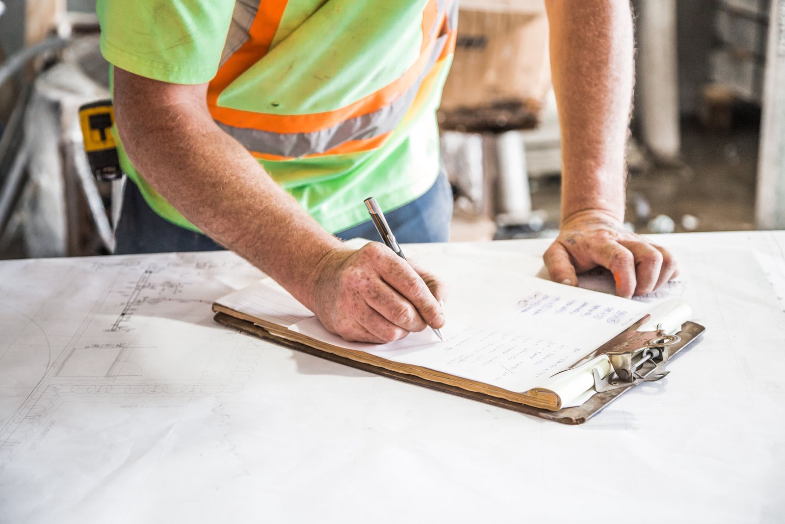 Property professional recording project risks on a clipboard