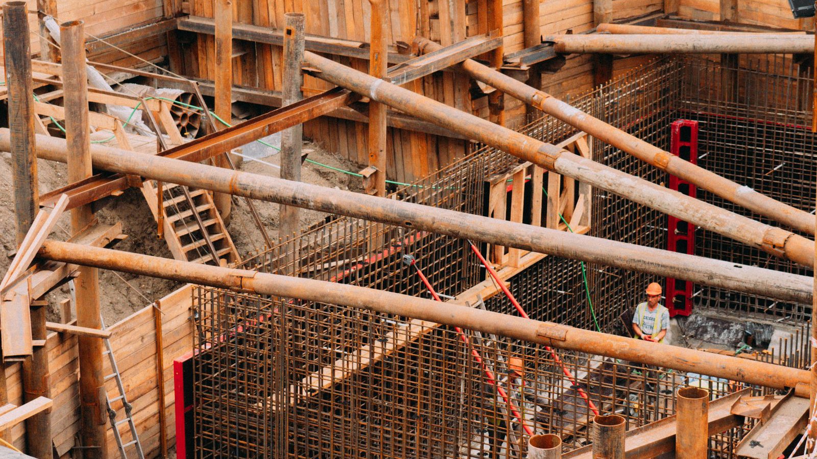 Timber shoring and props supporting an excavation next to an existing building