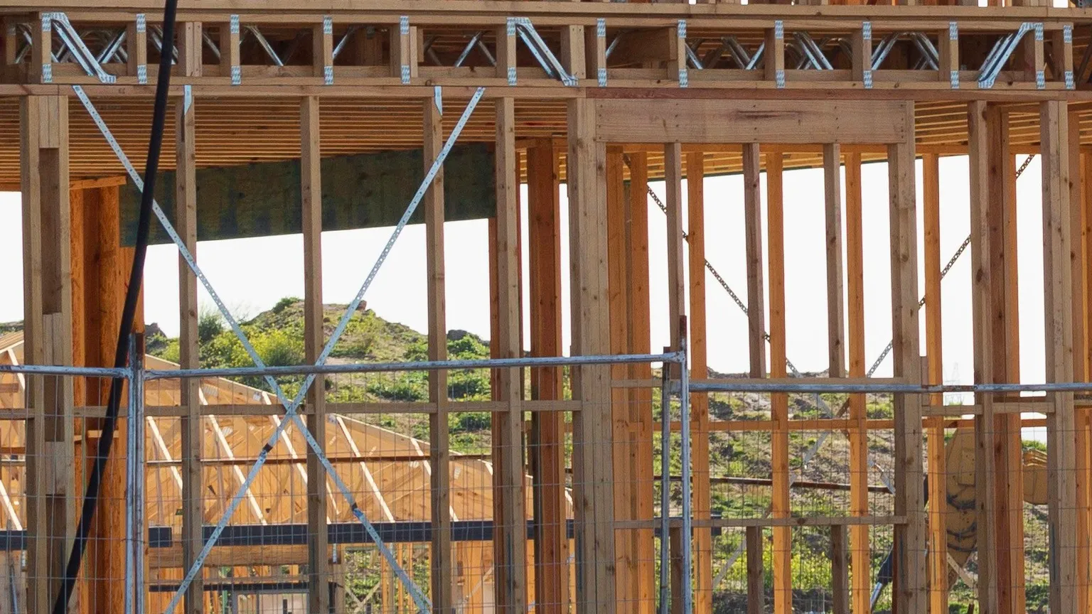 Timber house framing, metal bracing and scaffolding in Clyde North, Victoria.
