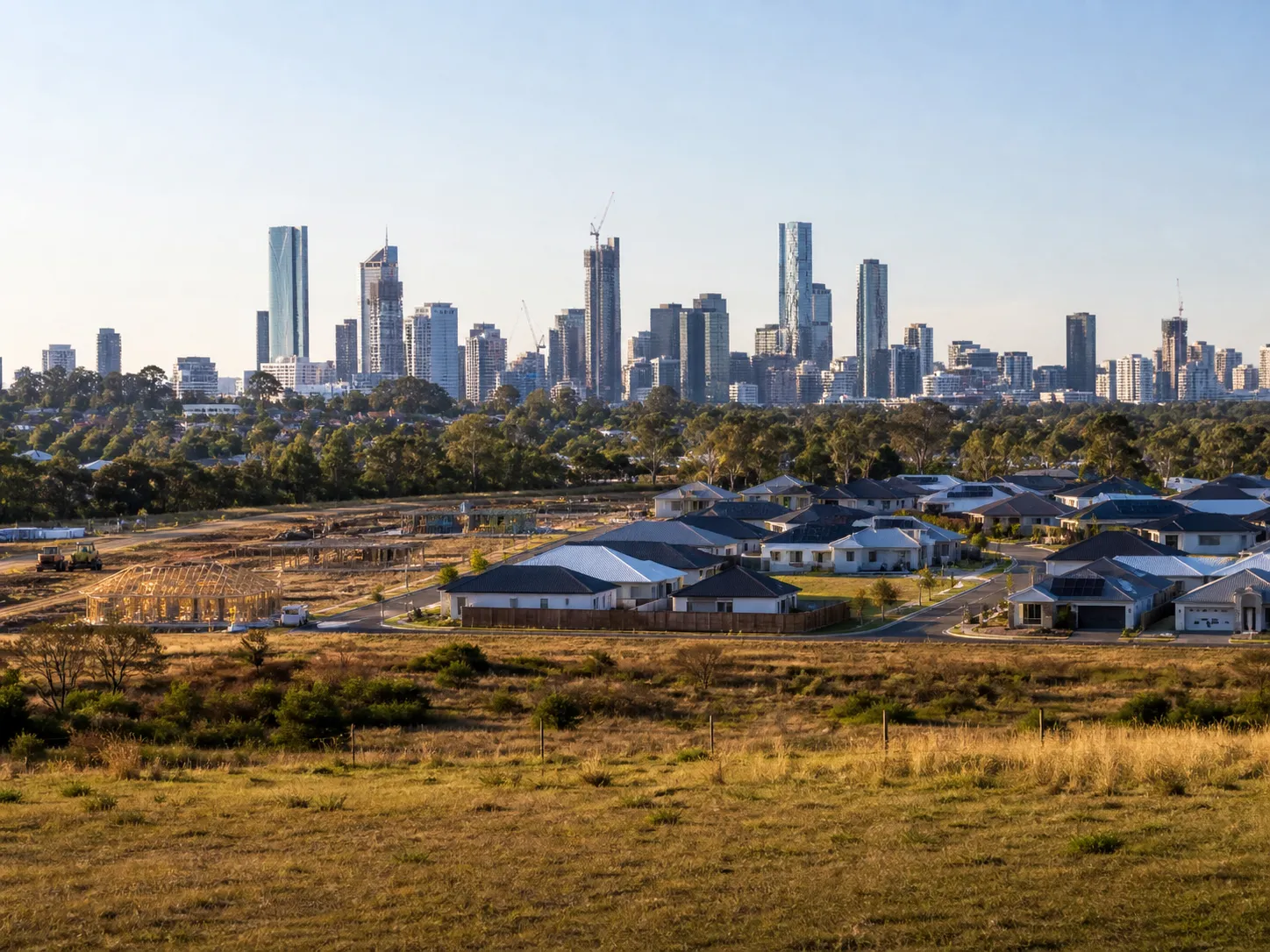 Split image contrasting a regional Australian town with a metro city skyline