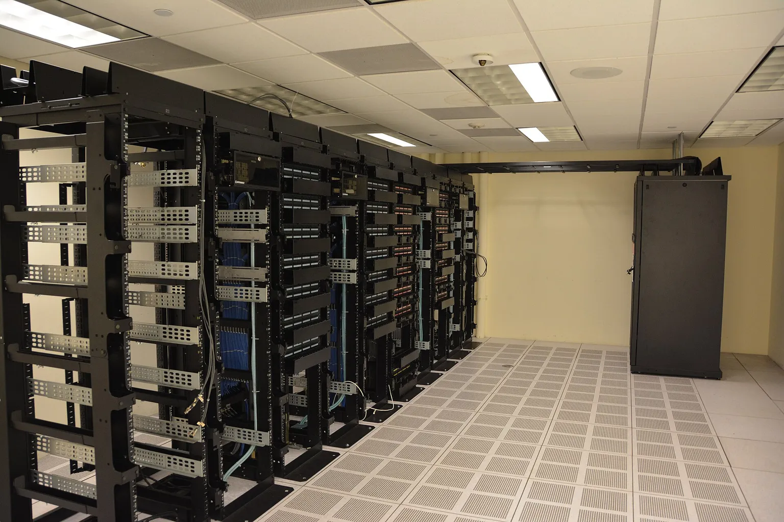 Rows of operational server racks inside a data centre