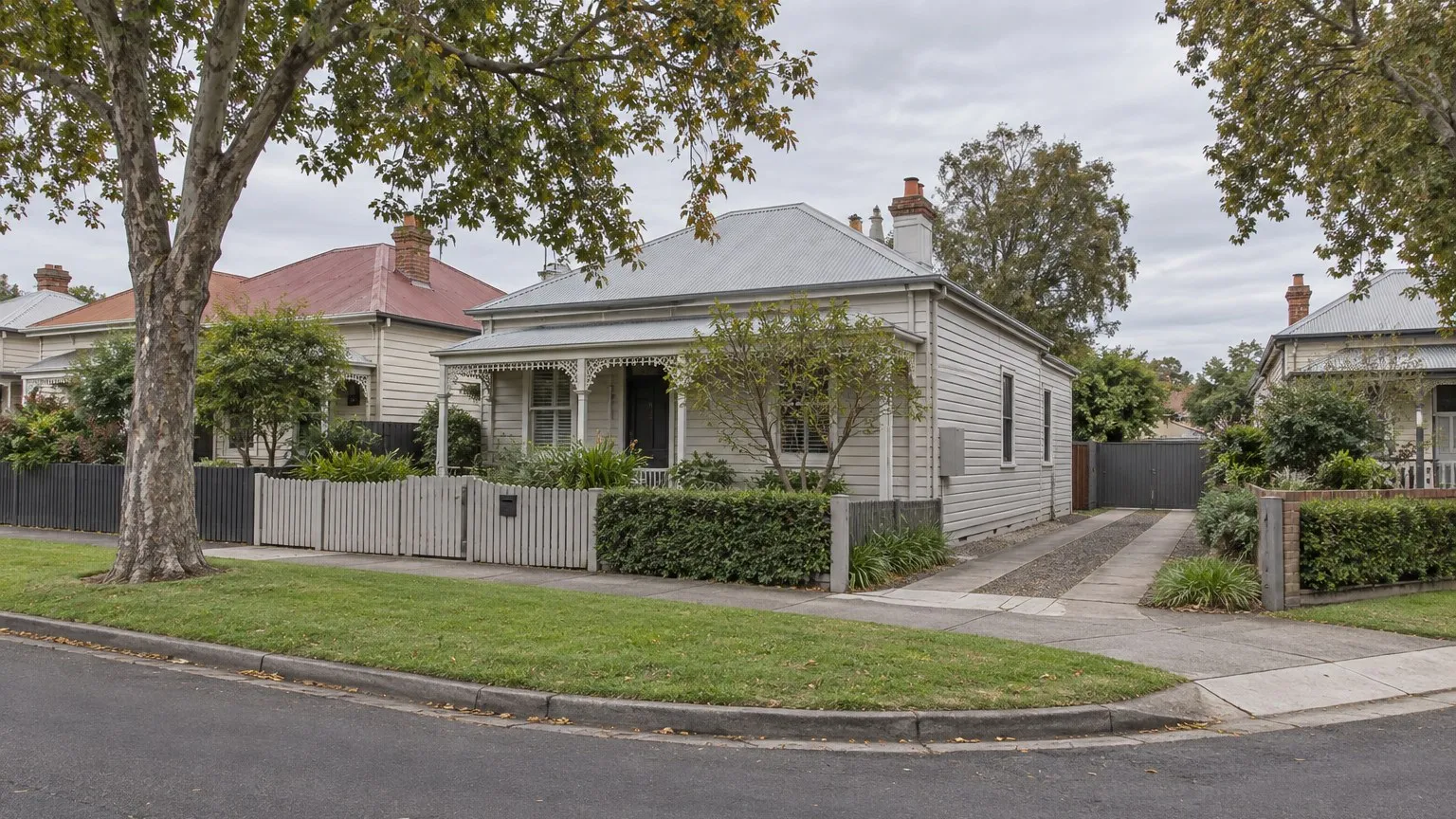 Illustrative view of a modest weatherboard house on a corner block in an established Australian suburban street with a side driveway
