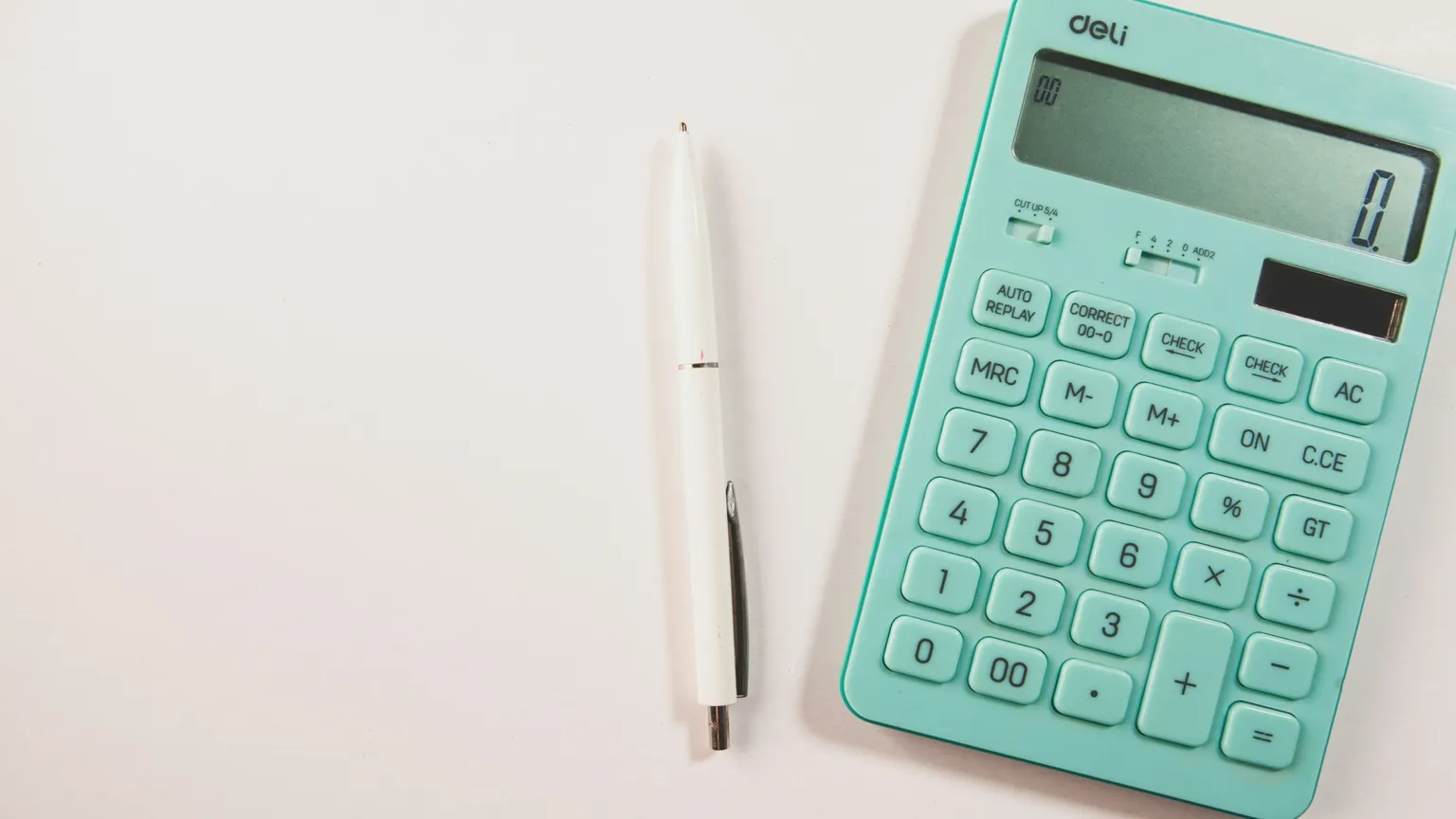 Calculator and pen on a desk used to illustrate Victorian rezoning tax and feasibility checks.